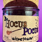 Purple glass candle jar with cork lid, printed Hocus Pocus label