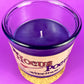 Candle jar with dark purple wax and a centered wick