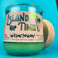 Recycled glass candle in teal jar with Island Time label, palm trees and butterfly