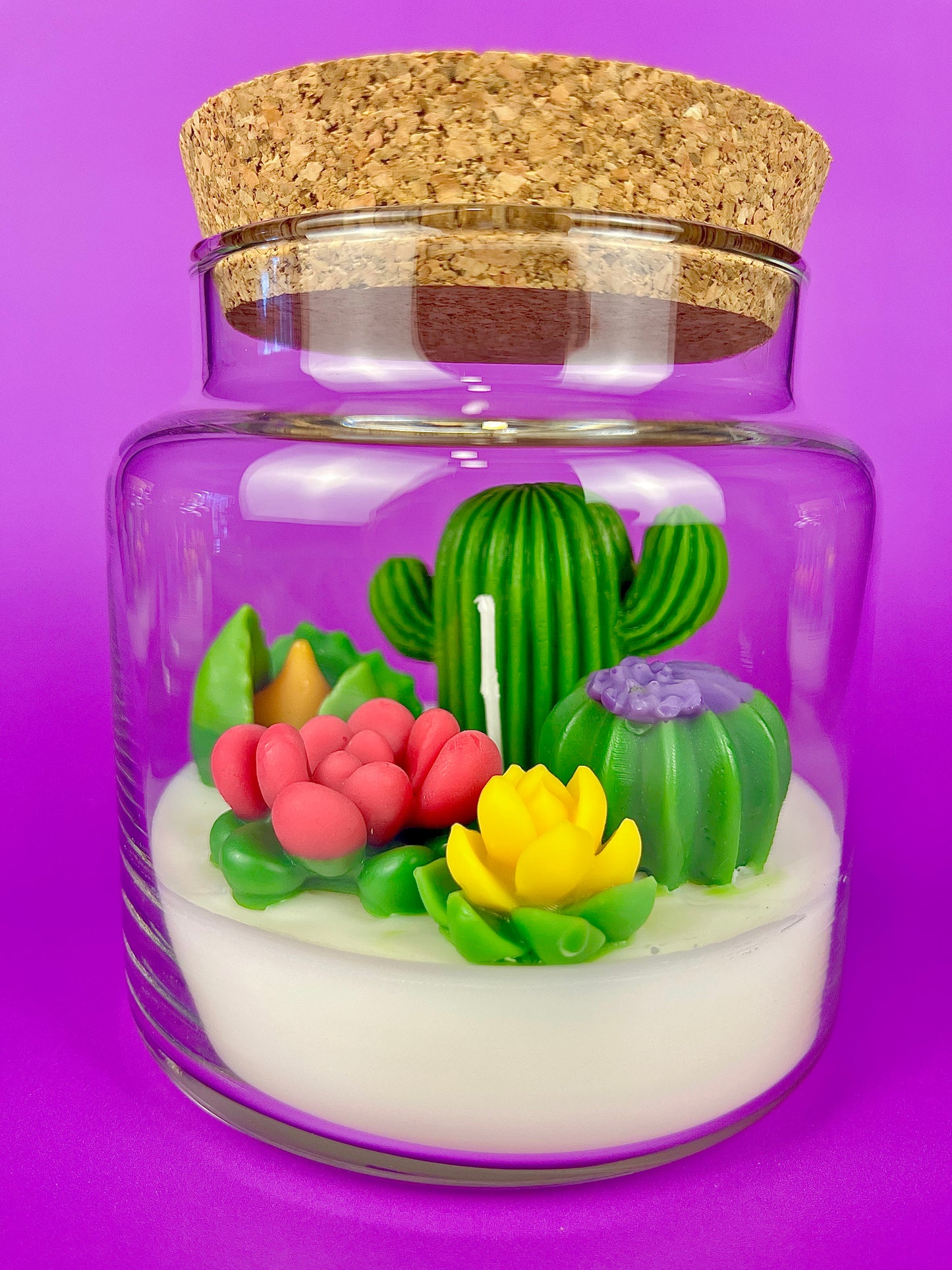 Cactus art candle with clear jar and cork lid; white wax with green cactus and pink petals