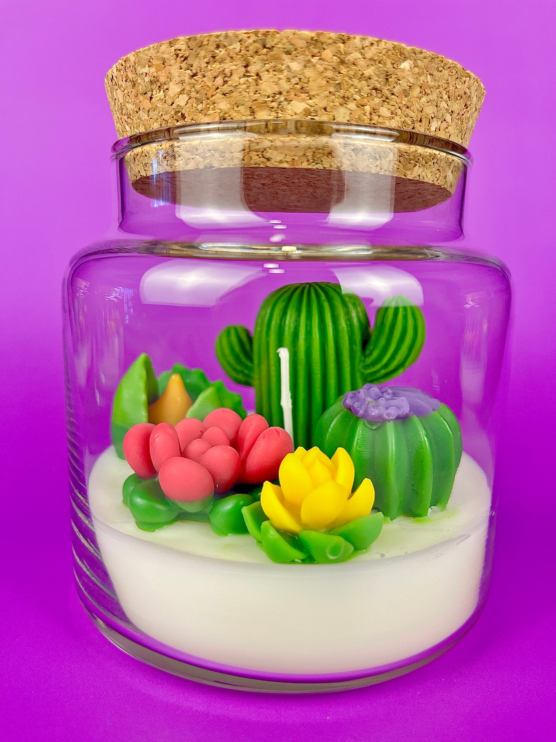 Cactus art candle with clear jar and cork lid; white wax with green cactus and pink petals
