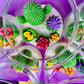 Large cactus art candle with cactus and flower wax pieces, seen through clear glass