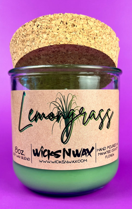 Recycled glass candle jar with green wax, cork lid, and Lemongrass WicksNWax label