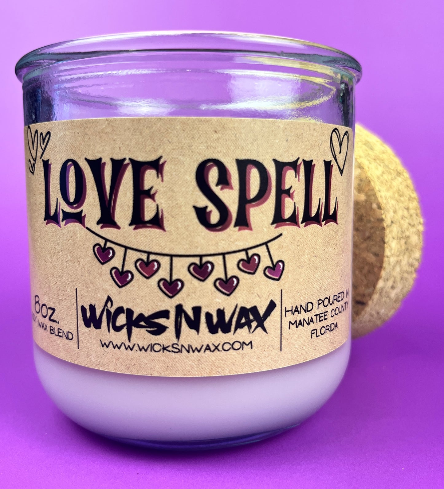 Recycled glass Love Spell candle with kraft label and dark purple heart design