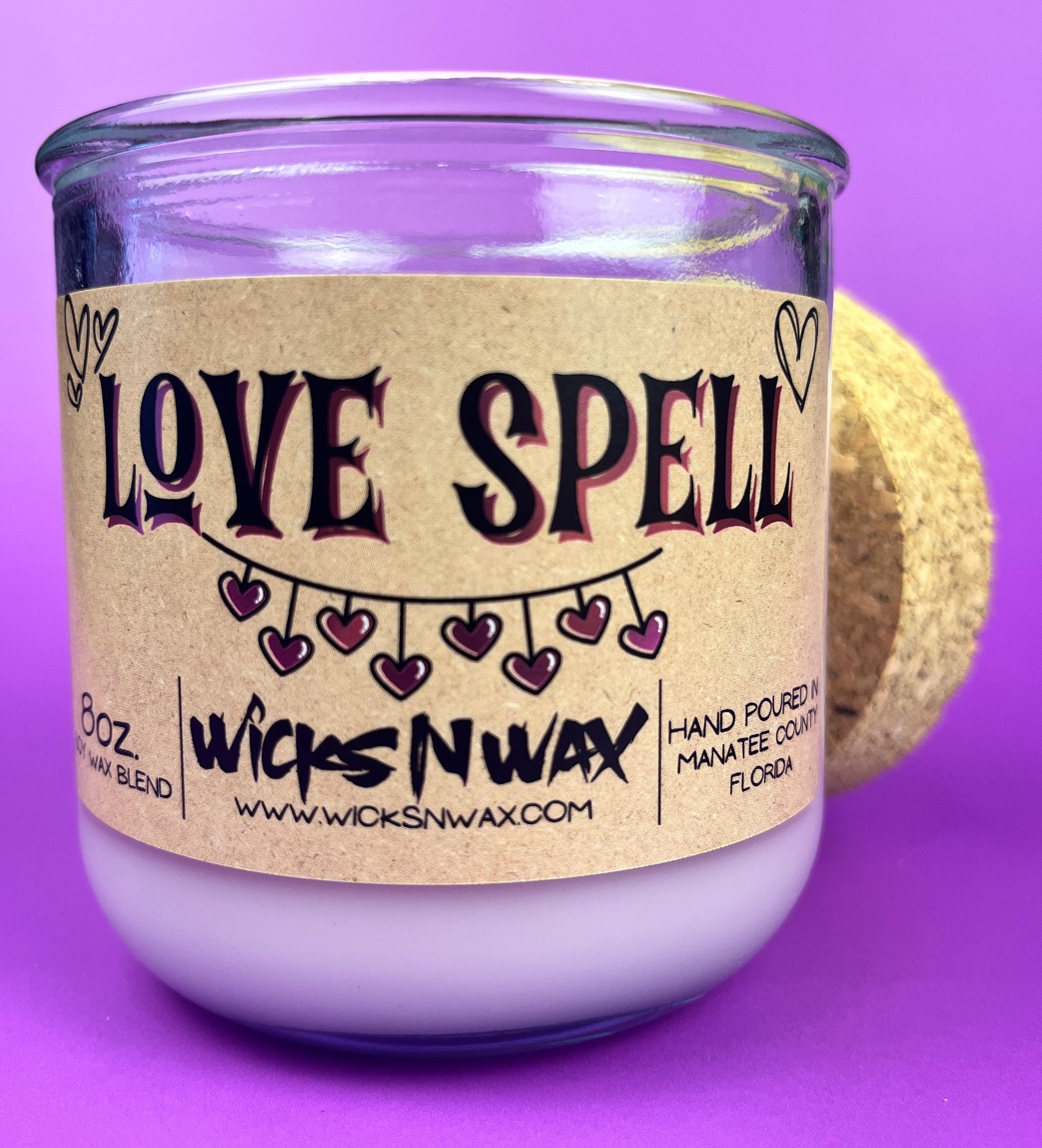 Recycled glass Love Spell candle with kraft label and dark purple heart design