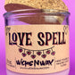 Recycled glass candle, purple jar with cork lid; beige label reading 'LOVE SPELL'