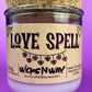 Recycled glass candle in purple glass with cork lid and beige 'LOVE SPELL' label