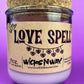 Recycled glass candle, purple jar with cork lid; beige 'LOVE SPELL' label on front