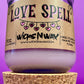 Recycled glass Love Spell candle with kraft label, hearts, and wide top view