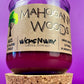 Recycled glass candle with cork lid and purple wax; cork coaster base shown.