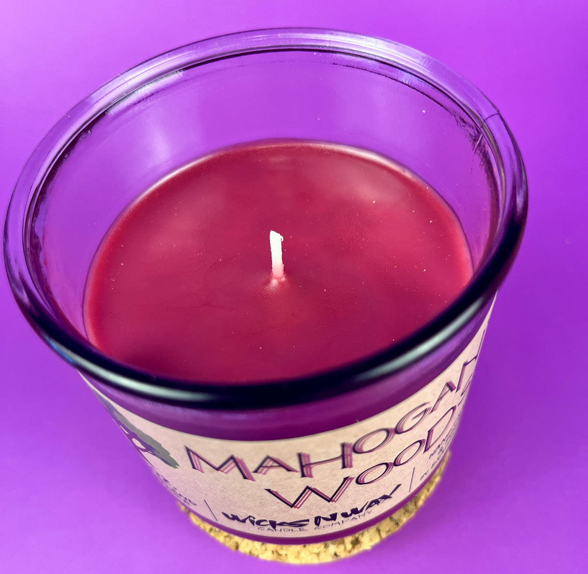 Recycled glass candle jar with burgundy wax and visible wick, Mahogany Woods