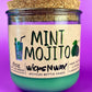 Recycled glass candle with mint-green wax, cork lid, label reading MINT MOJITO