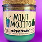 Recycled glass candle with mint-green wax, cork lid, side text and icons visible