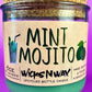 Recycled bottle candle with mint-green wax, cork lid, MINT MOJITO label visible