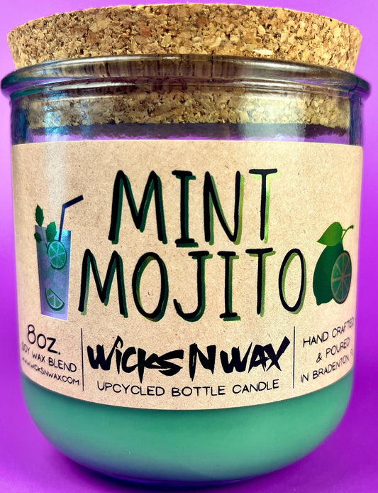 Recycled bottle candle with mint-green wax, cork lid, MINT MOJITO label visible