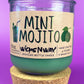 Recycled glass candle with mint-green wax, cork base, MINT MOJITO label and citrus icons