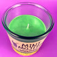 Mint-green candle in recycled glass jar, single wick centered, cork base visible