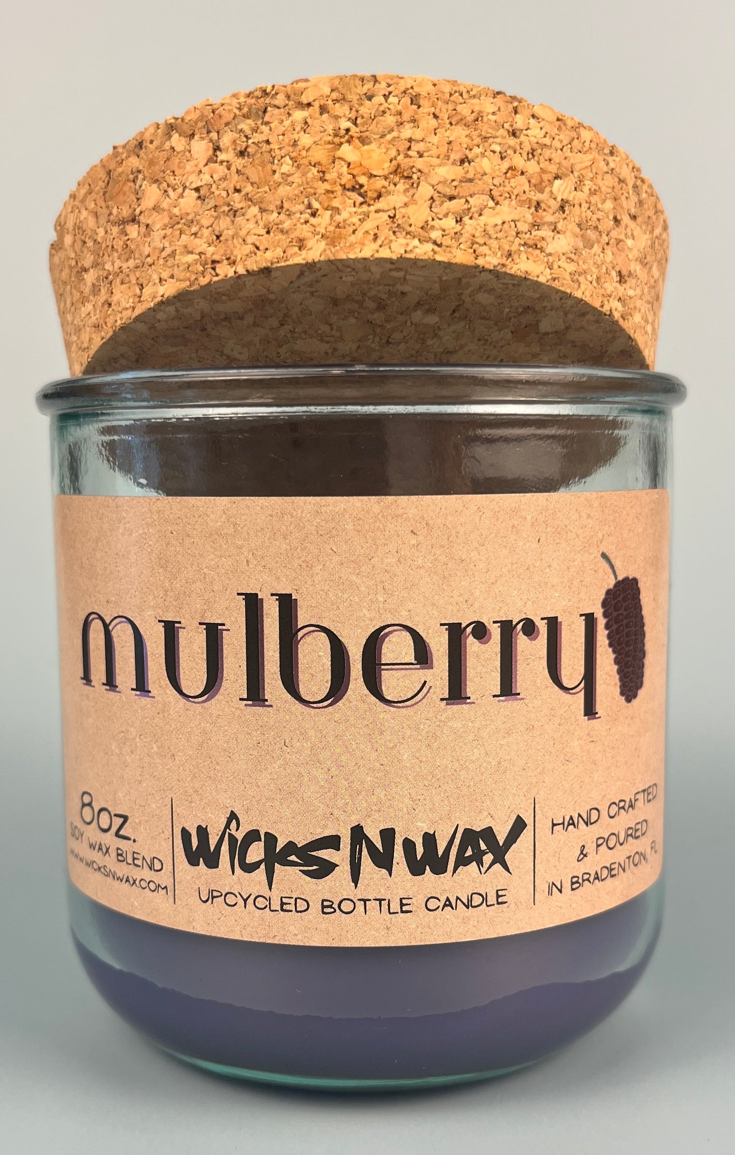 Mulberry WicksNWax upcycled bottle candle in clear glass jar, label with dark wax