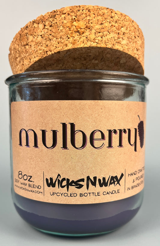 Mulberry WicksNWax upcycled bottle candle in clear glass jar, full label and cork top