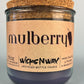 Mulberry WicksNWax upcycled bottle candle in clear glass jar, side label and cork top
