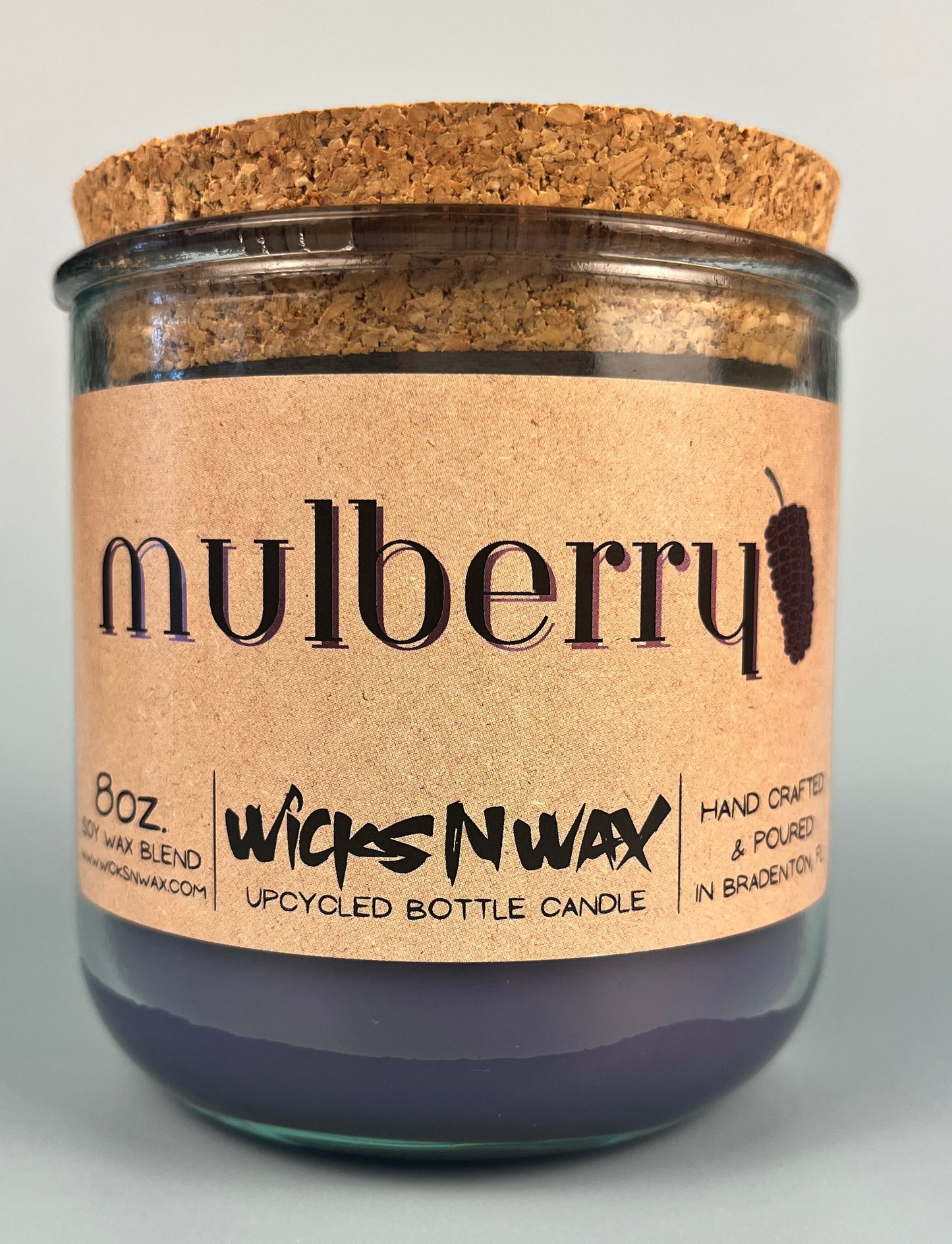 Mulberry WicksNWax upcycled bottle candle in clear glass jar, side label and cork top