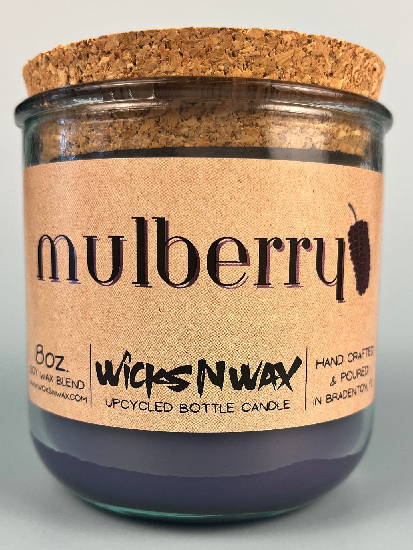 Mulberry WicksNWax upcycled bottle candle in clear glass jar, cork top visible