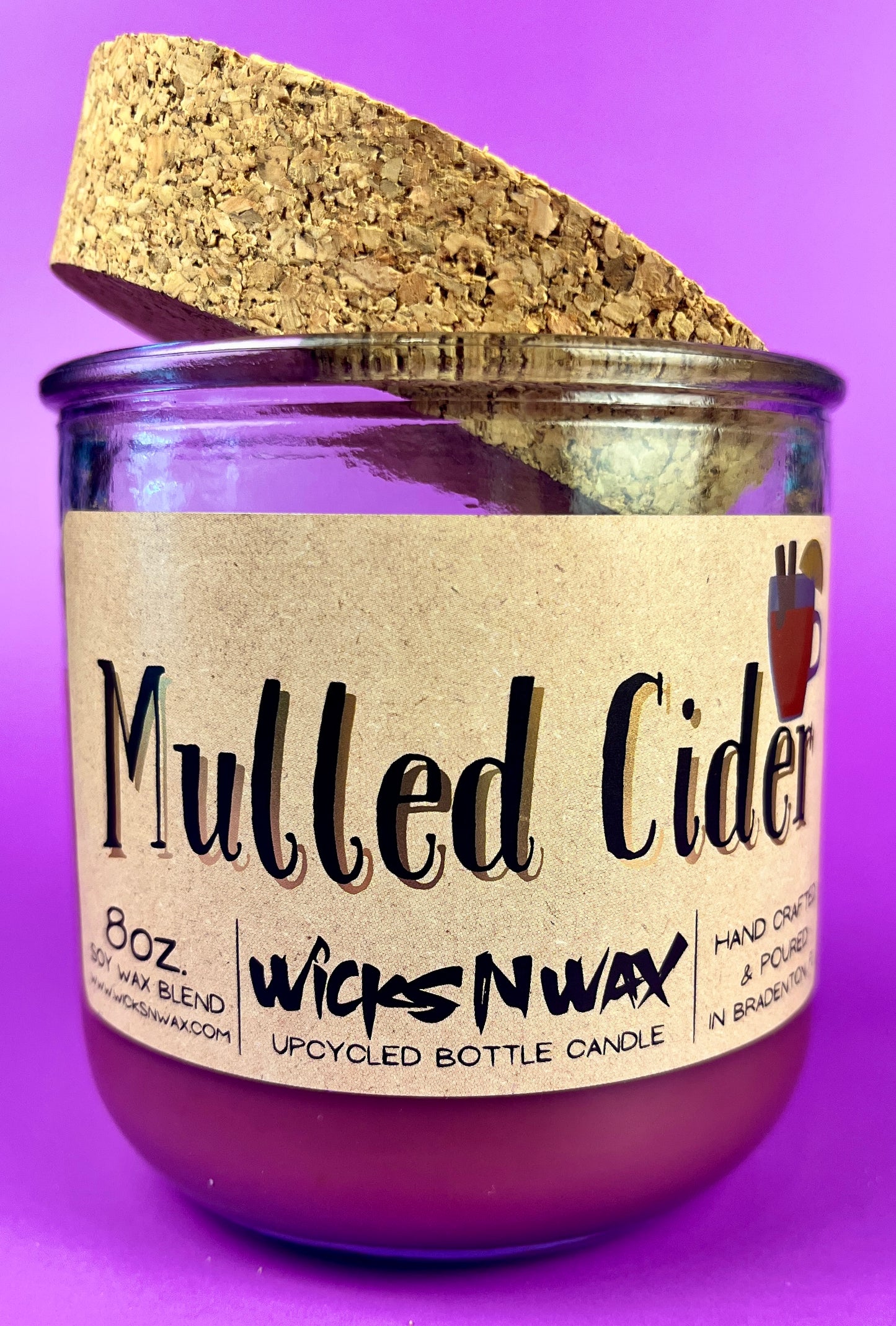 Mulled Cider recycled glass candle with cork lid, purple wax, angled front label