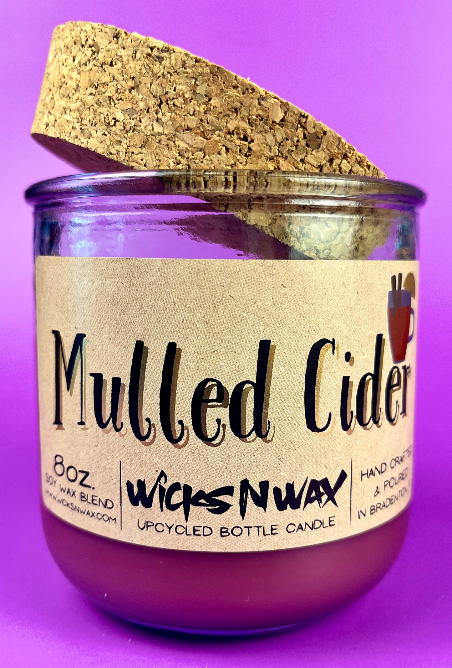 Mulled Cider recycled glass candle with cork lid, purple wax, close front view