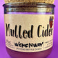 Mulled Cider recycled glass candle with cork lid, purple wax, centered front label