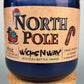 Recycled blue glass candle with cork base, North Pole label, WicksNWax branding.