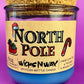 Recycled bottle candle with blue wax, kraft label, and cork coaster