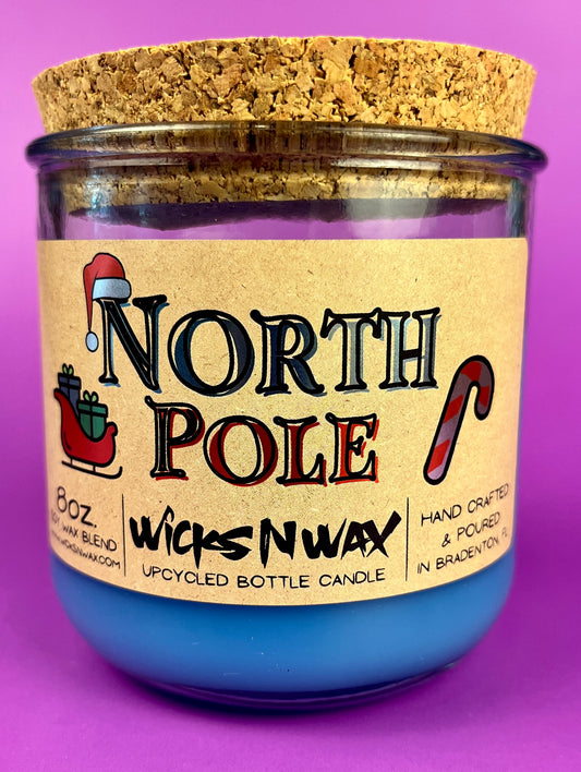 Recycled bottle candle with blue wax, kraft label, and cork coaster