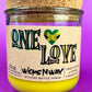 Recycled glass candle jar with cork base, yellow wax, One Love label.