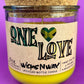 Recycled glass candle jar with cork base, yellow wax, One Love label.