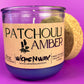 Recycled glass candle label on clear jar with purple wax, cork lid behind.