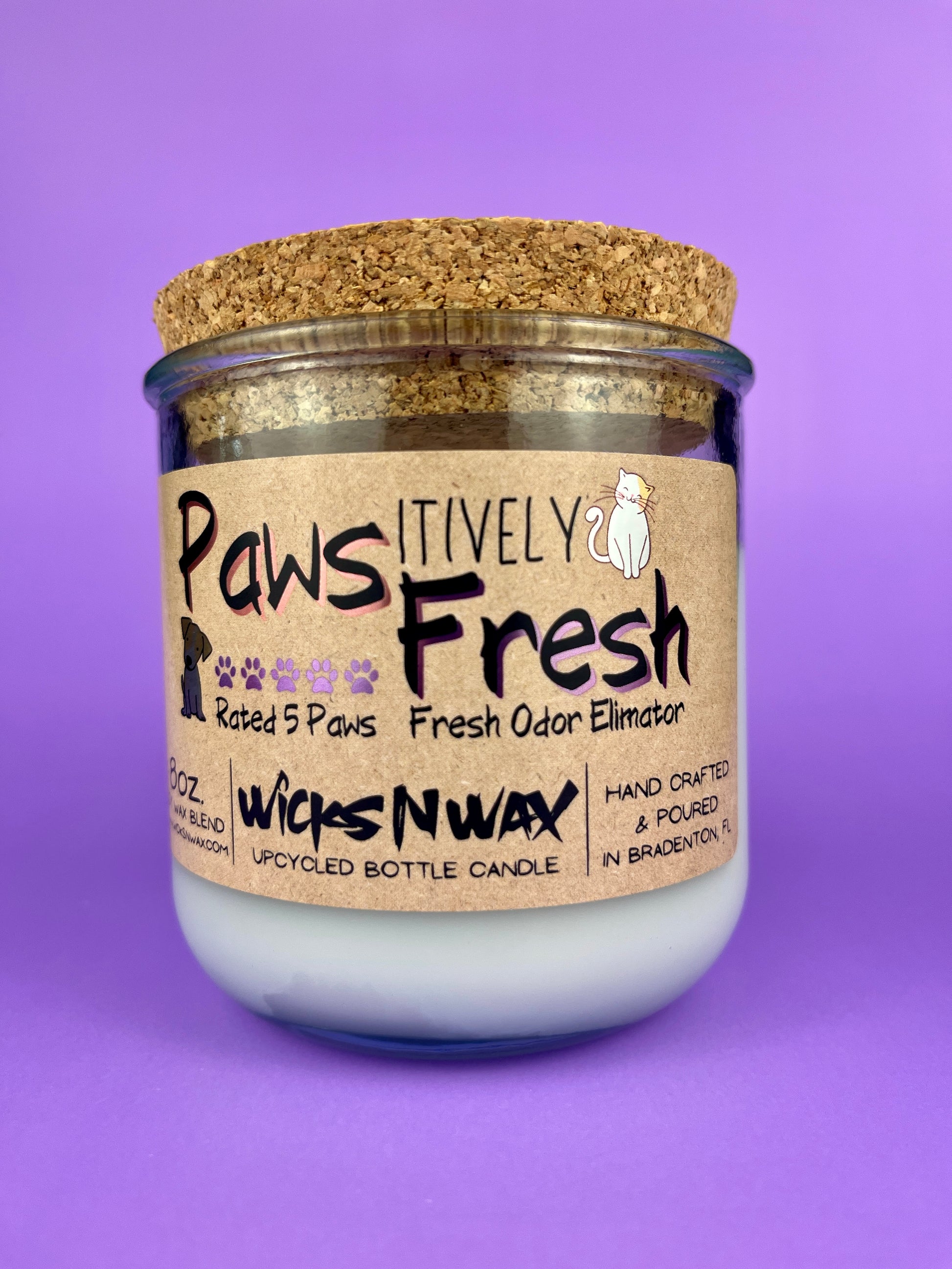 Recycled glass candle with white wax and cork lid, front label with pet paw icons