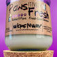 Recycled glass candle with white wax and cork base, label with paw and “Fresh” text
