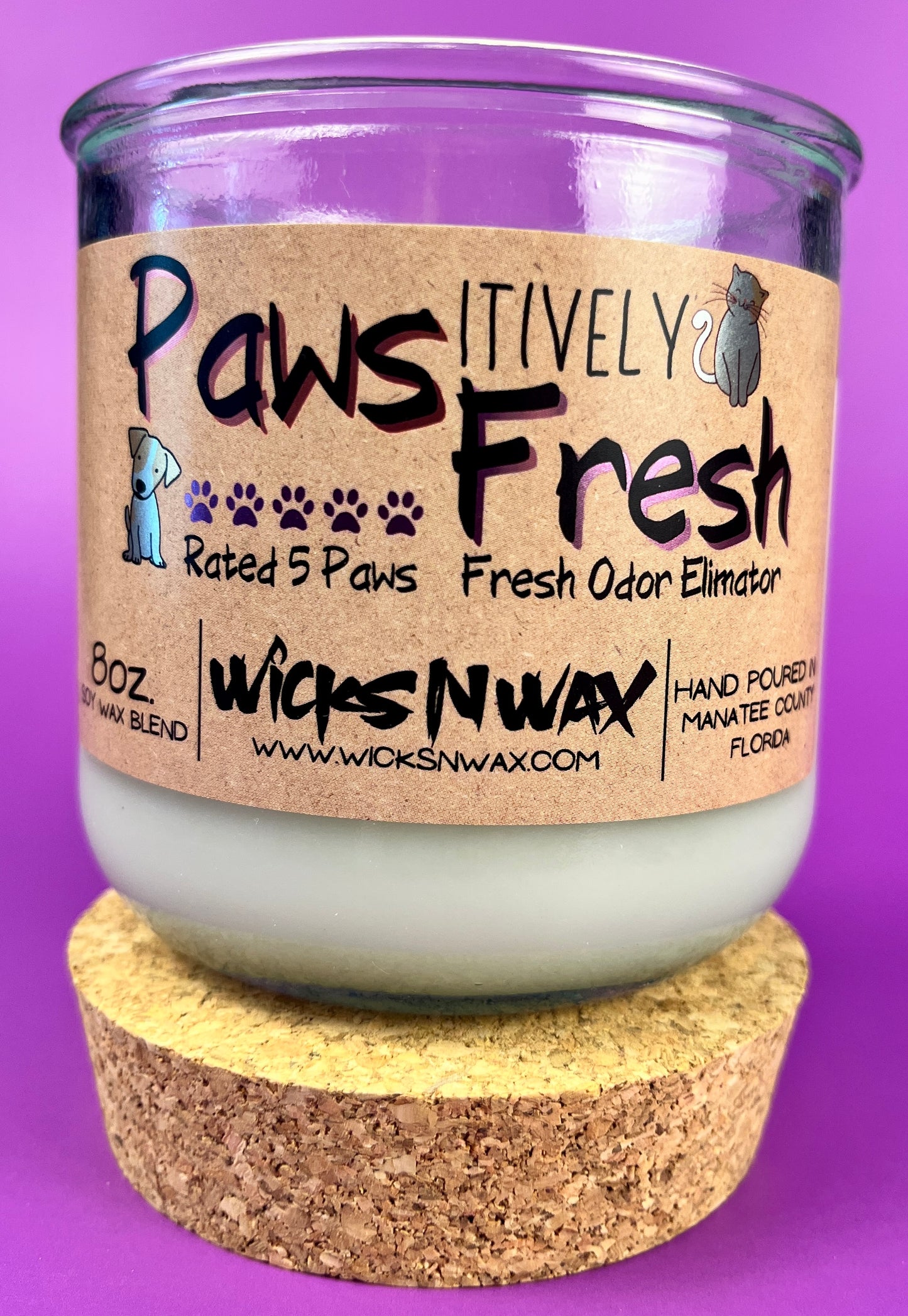 Recycled glass candle with white wax and cork base, paw-themed candle label