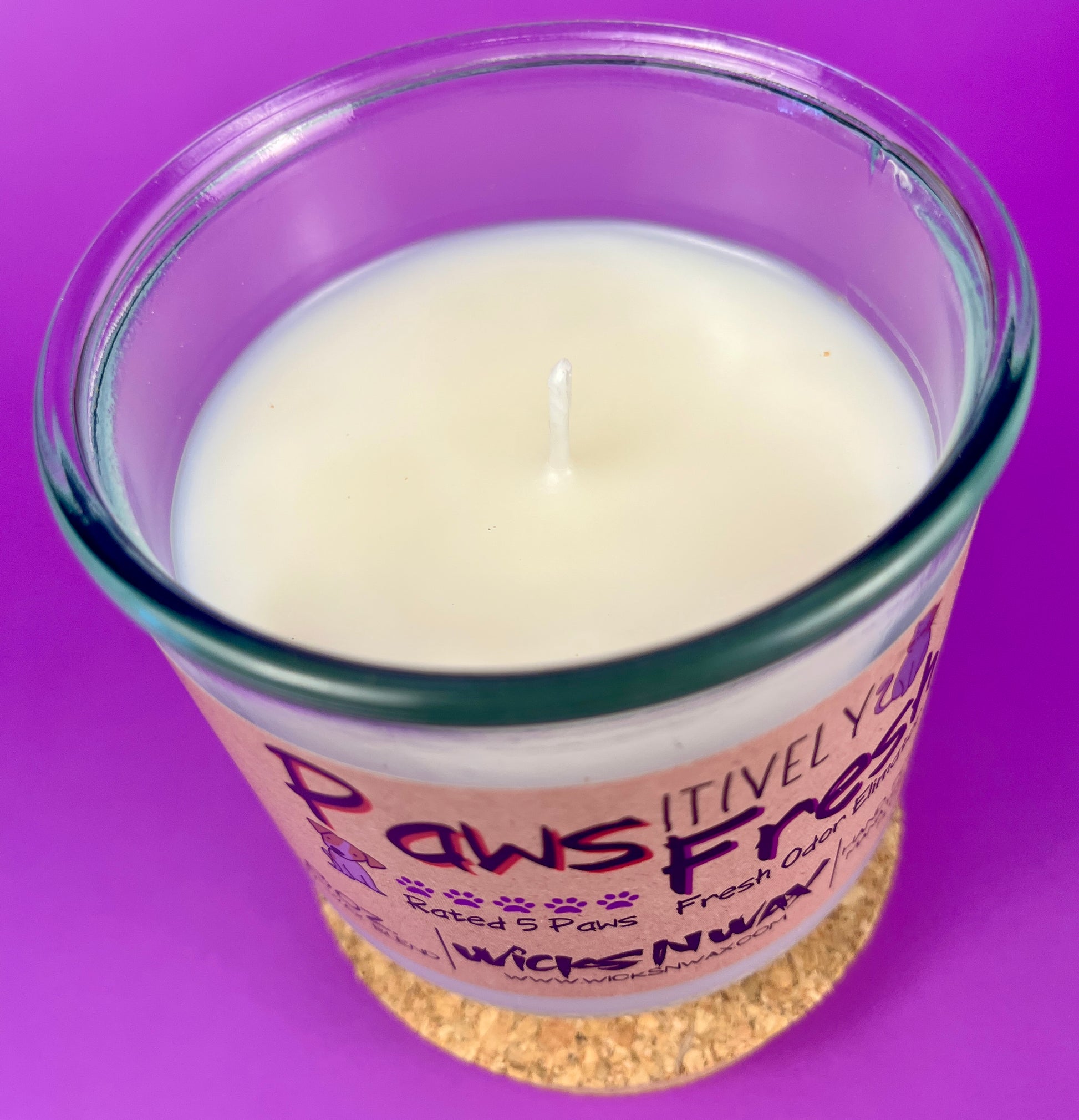 Recycled glass candle with white wax and cork lid, paw-themed front design