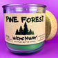 Pine Forest recycled glass candle with green wax in a purple glass jar, cork lid