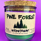 Pine Forest WicksNWax recycled bottle candle with green wax in clear jar