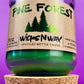 Pine Forest recycled glass candle with green wax in clear jar and cork base