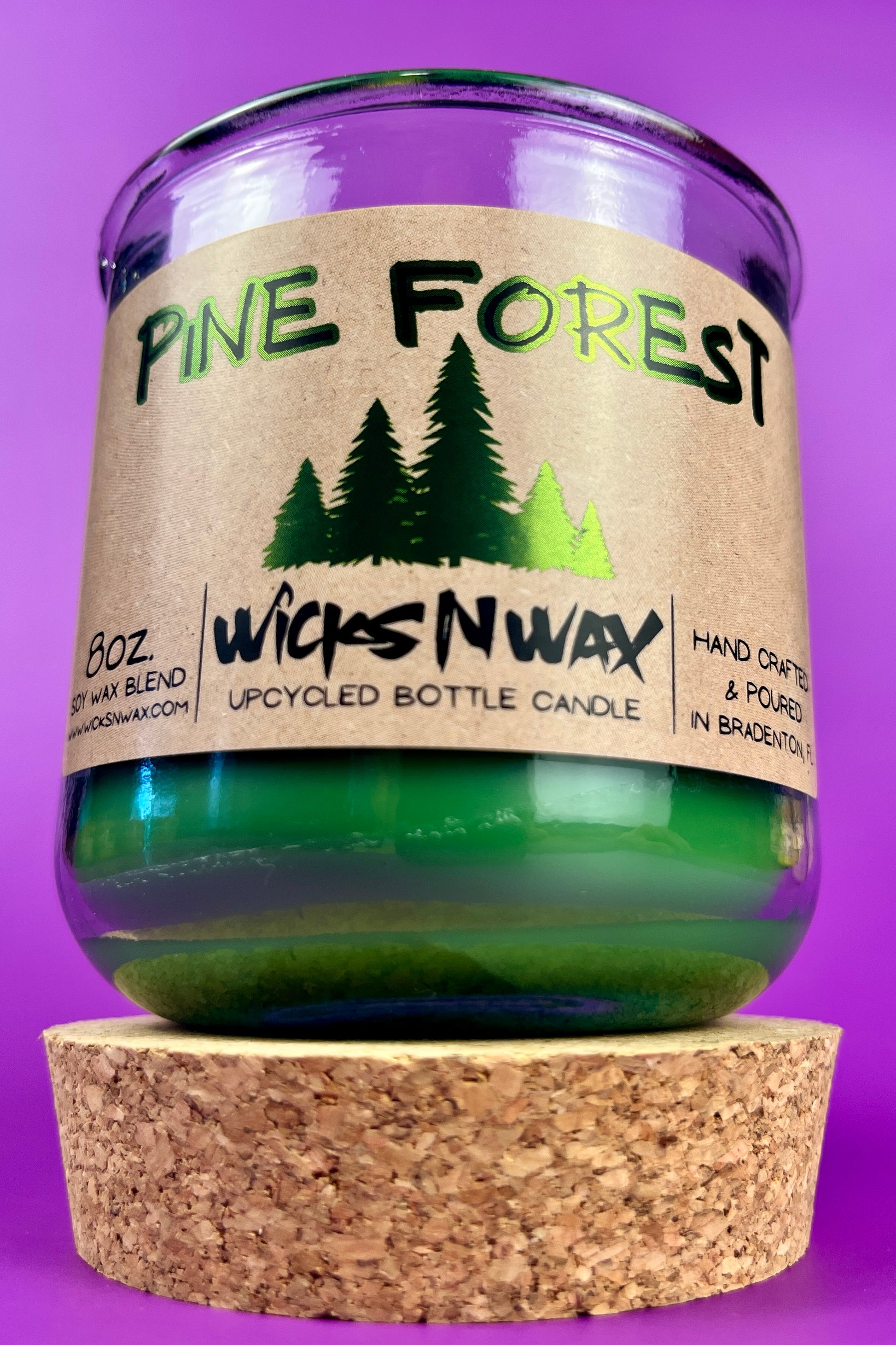 Pine Forest recycled glass candle with green wax in clear jar and cork base