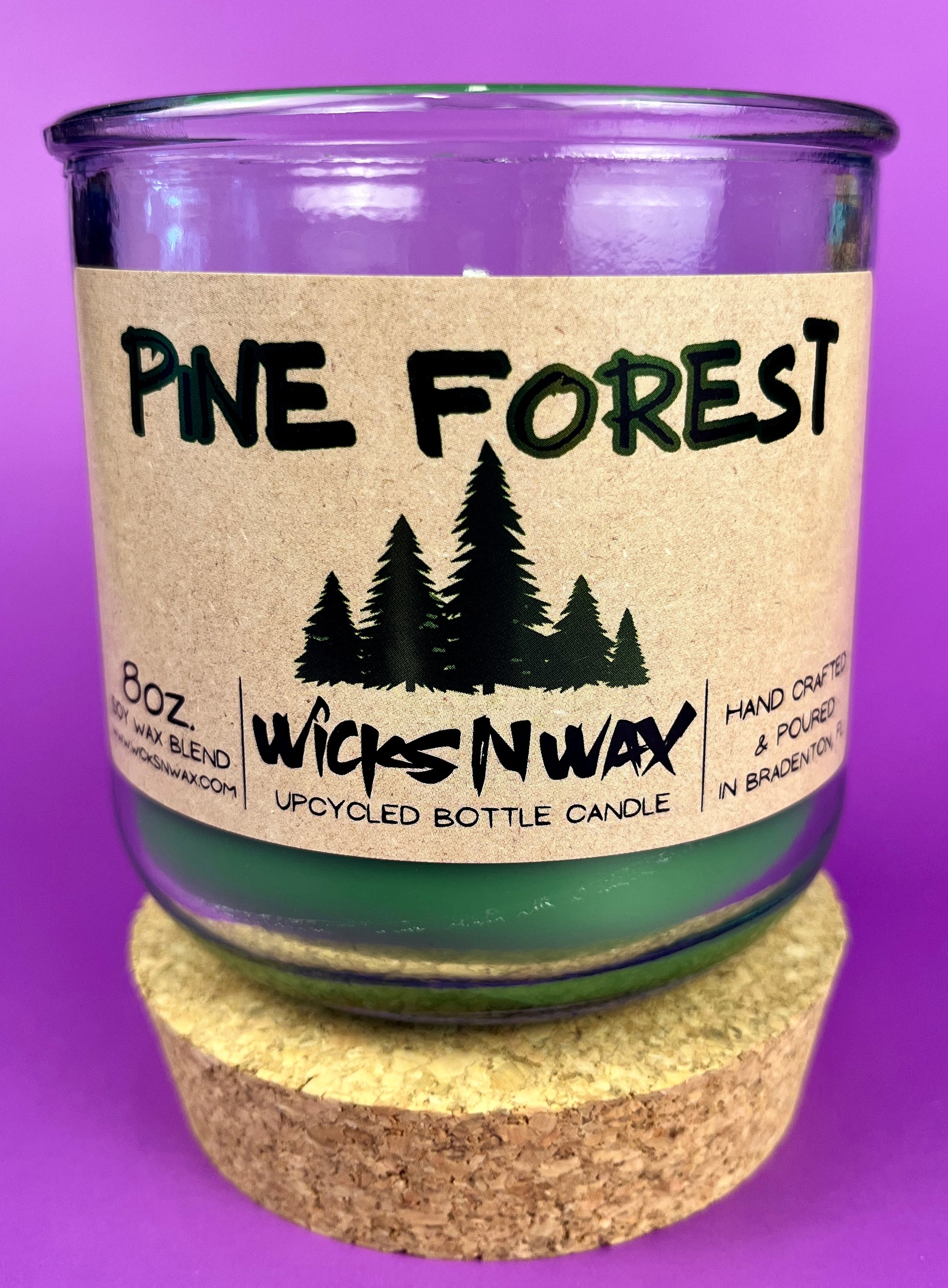Pine Forest WicksNWax upcycled bottle candle in clear glass jar, green wax level