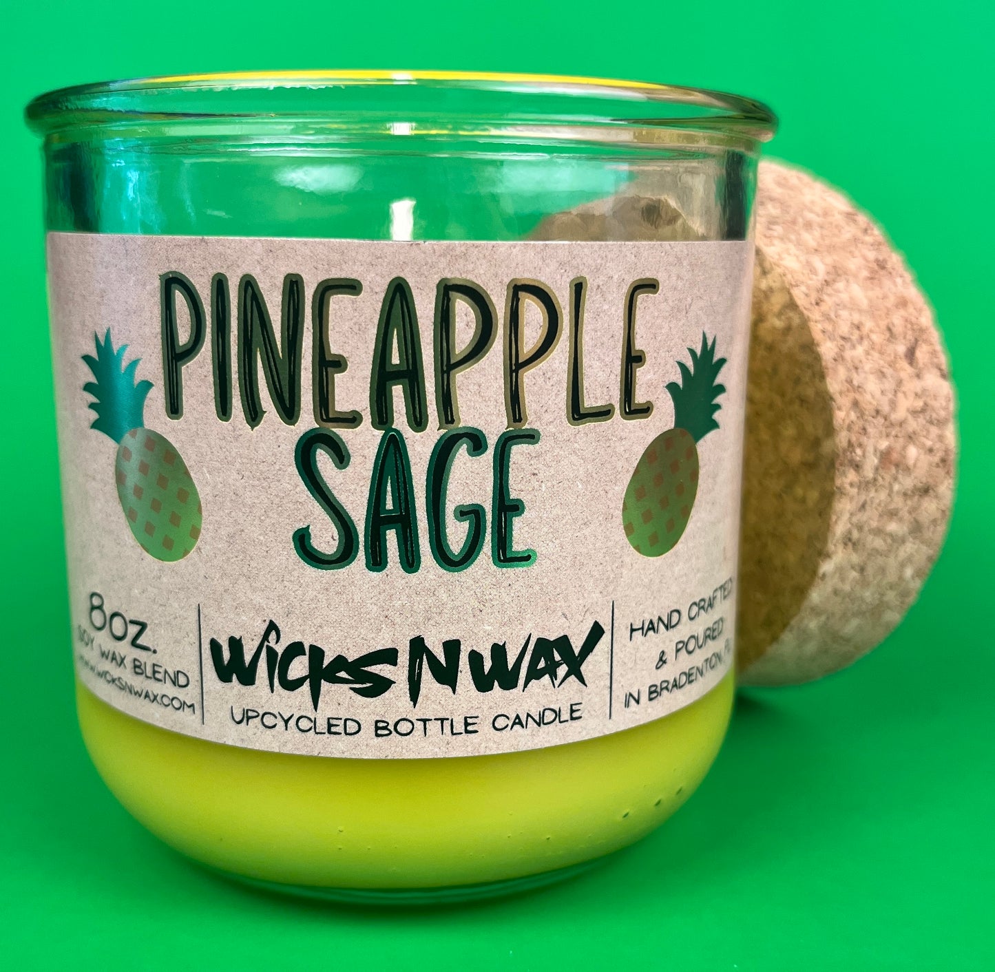 Pineapple Sage recycled glass candle, cork lid and label on green glass jar with yellow wax