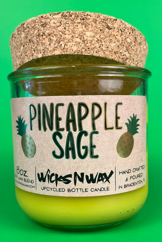Pineapple Sage recycled glass candle with cork lid and lime-yellow wax in green jar
