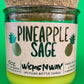 Pineapple Sage recycled glass candle with cork lid and lime-yellow wax, in green glass jar
