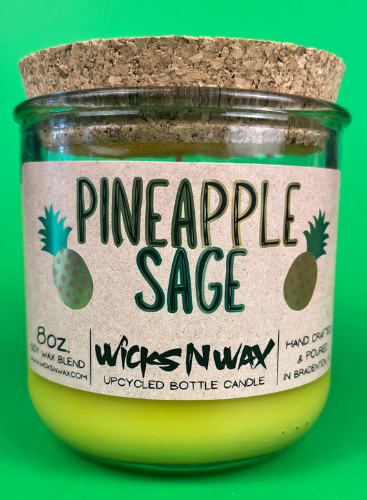 Pineapple Sage recycled glass candle with cork lid and lime-yellow wax, in green glass jar