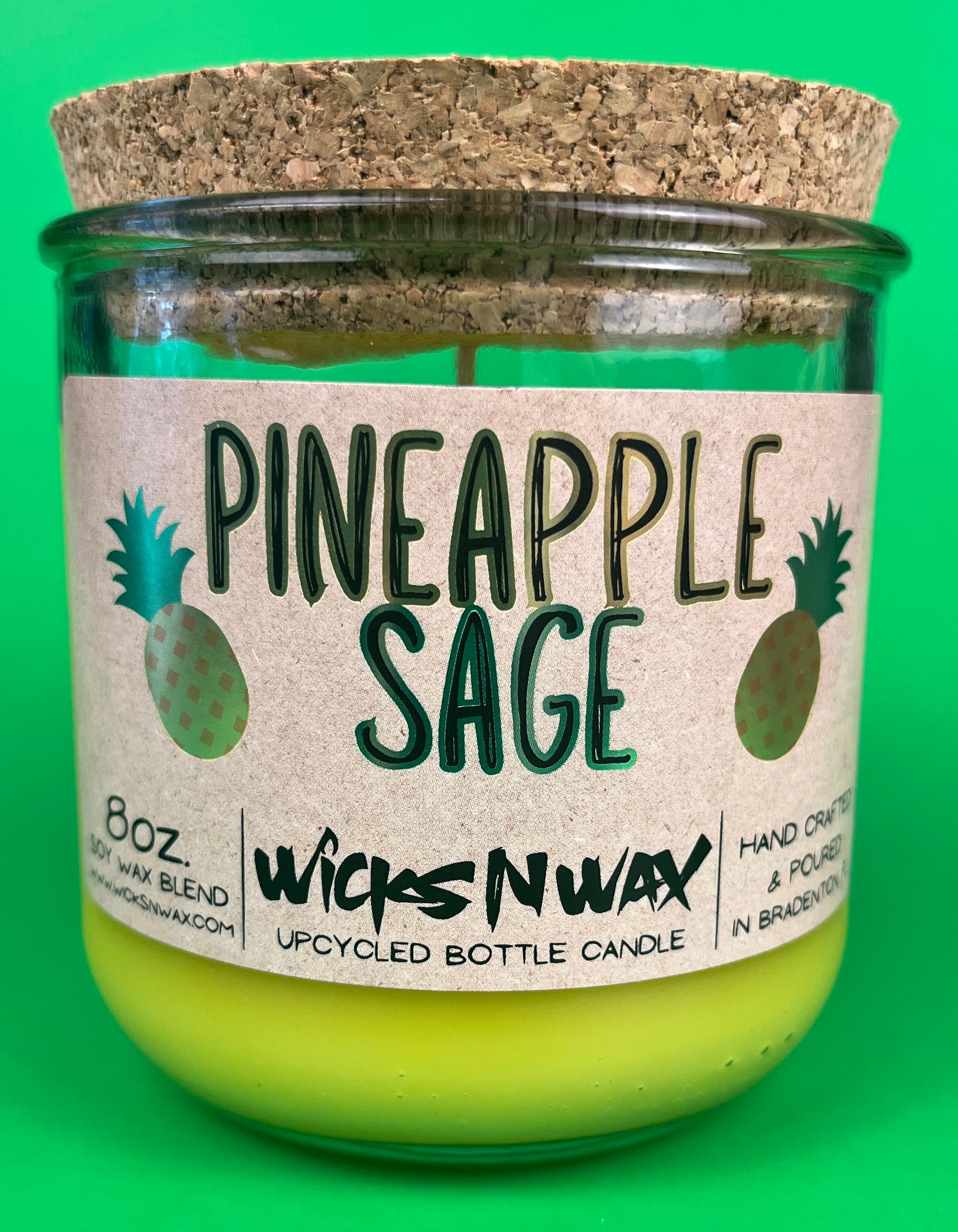 Pineapple Sage recycled bottle candle with cork lid and green glass jar, lime-yellow wax