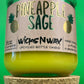 Pineapple Sage recycled glass candle with green glass jar and cork base, yellow wax at bottom